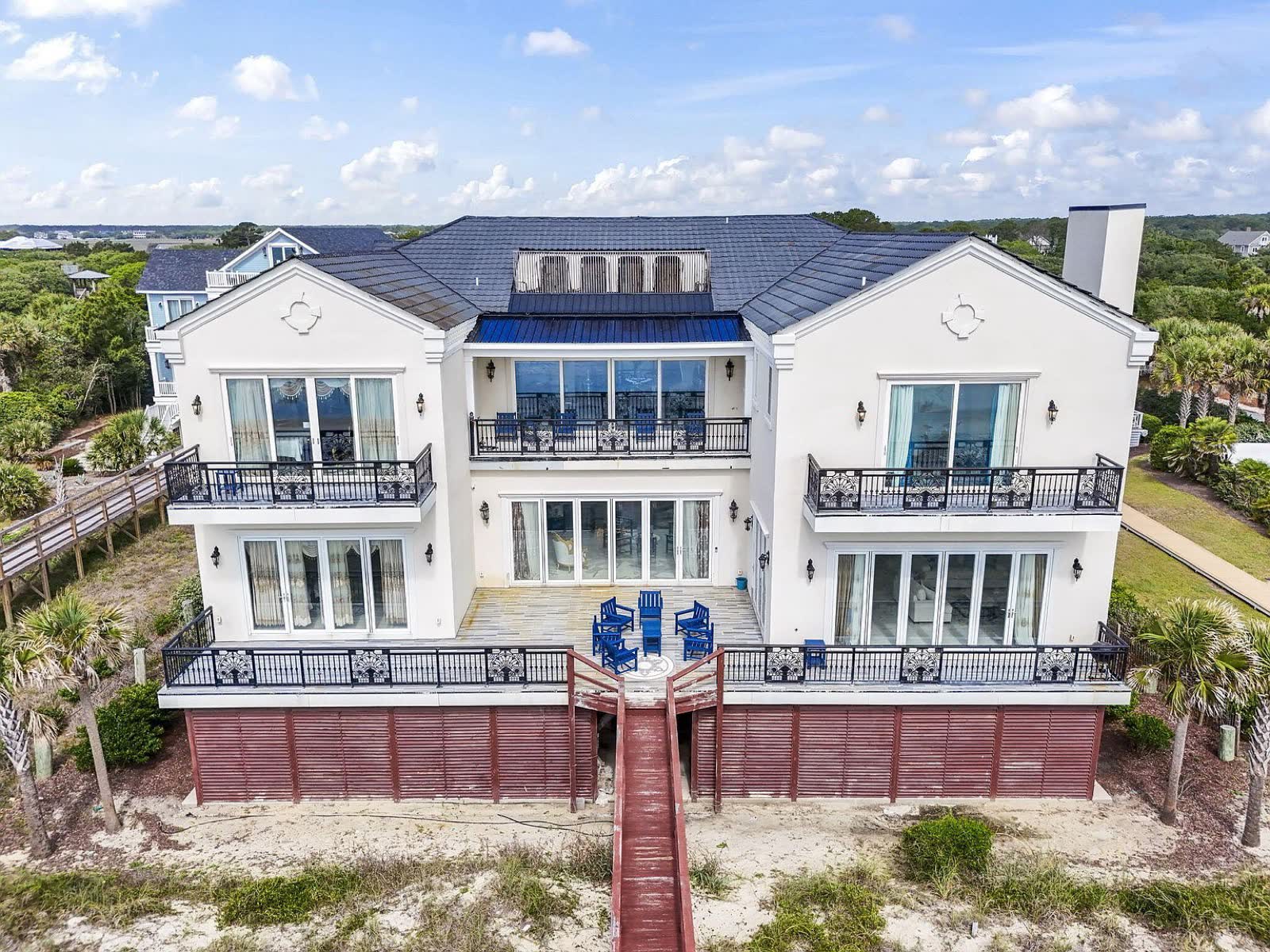 Aerial of the oceanfront facade and private boardwalk
